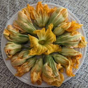 Squash Blossoms Stuffed with Ricotta, Peas, Shallots, and Salmon